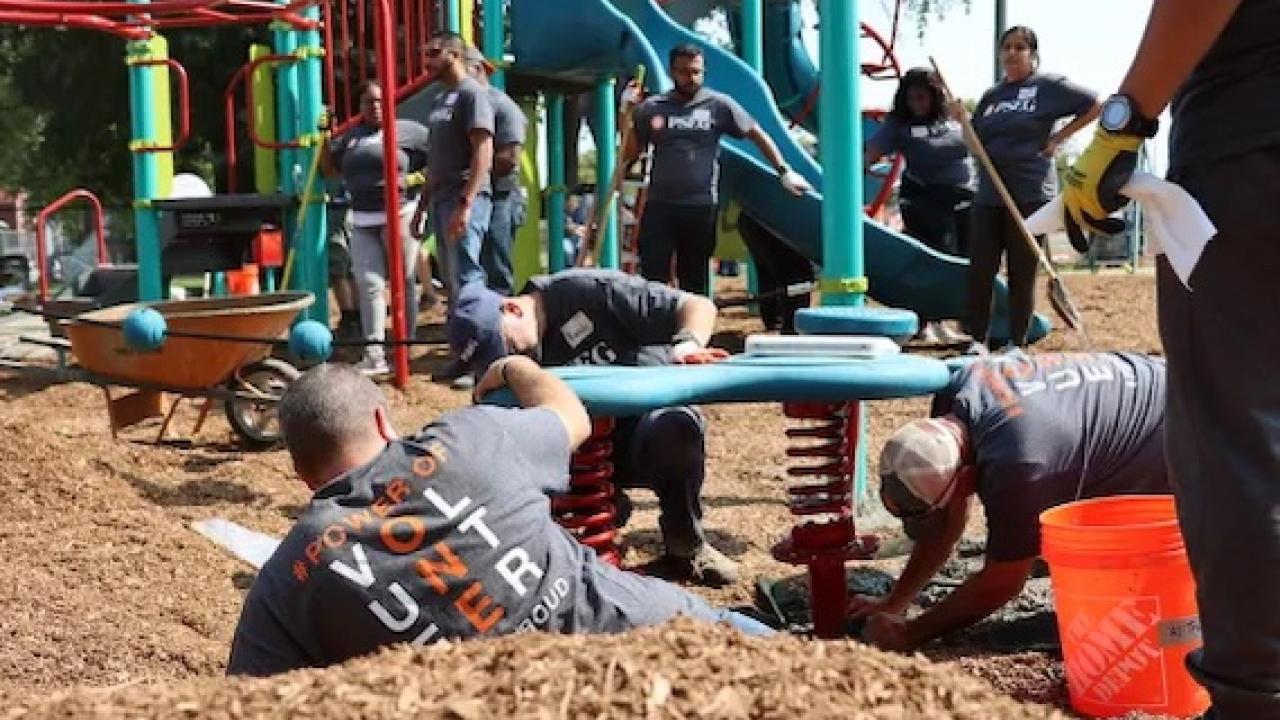 Volunteers shown assembling the playground.