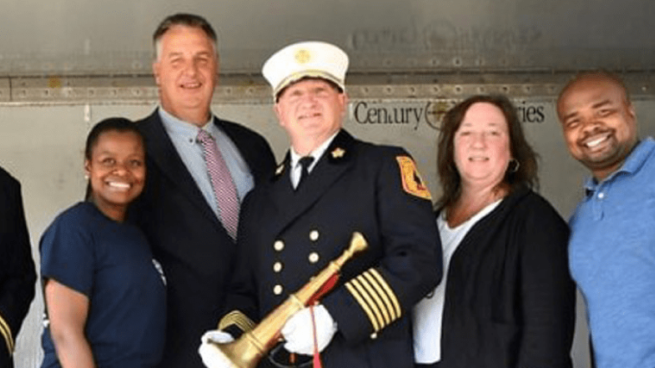 Pictured on the reviewing stand in the feature image (left to right) are Battalion Chief Scott McDermott, Councilwoman Denise Ridley, Dwyer, Fire Chief Steve McGill, Councilwoman Mira Prinz-Arey and Councilman Jermaine Robinson.