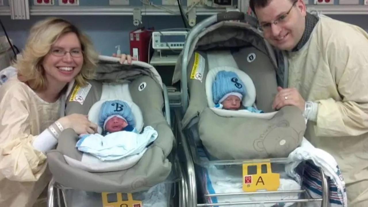 Family with infants in car seats.