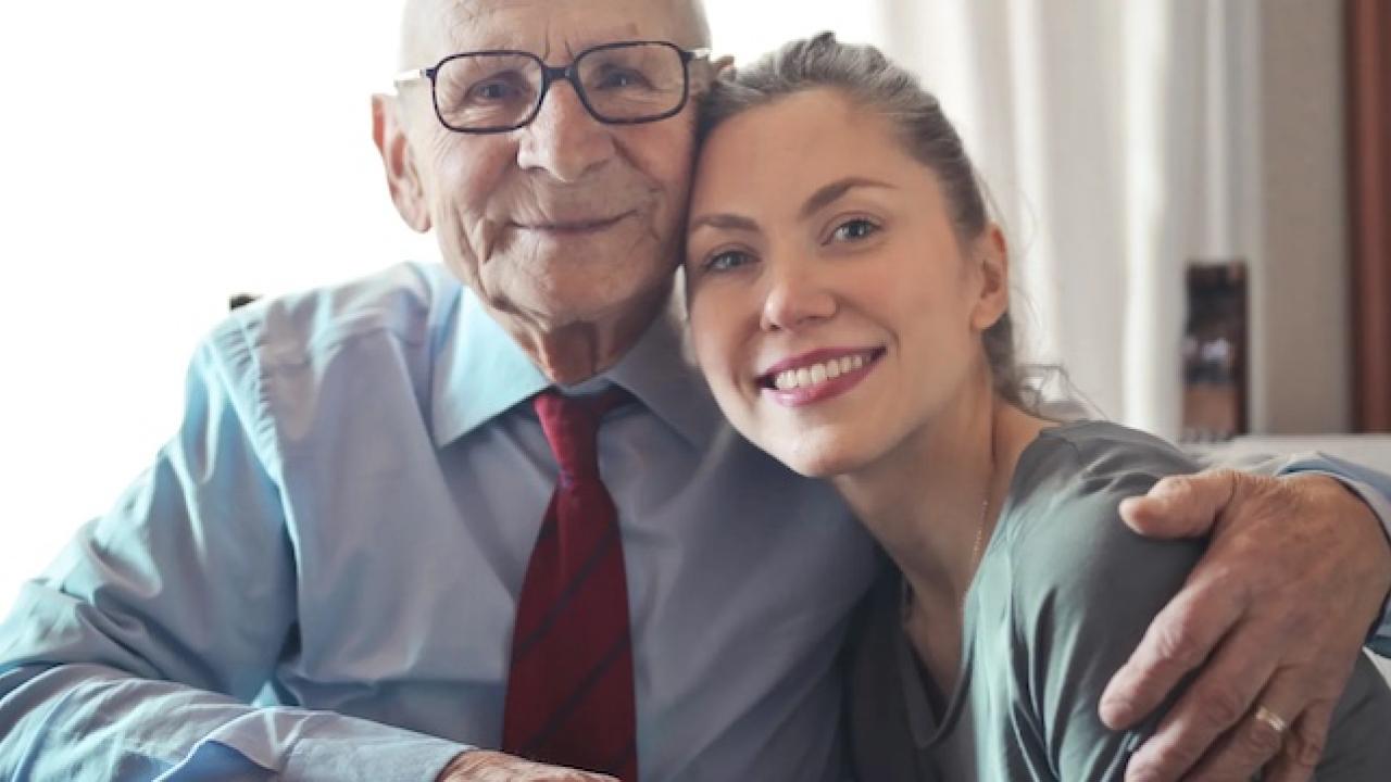 Elderly man shown with his daughter.