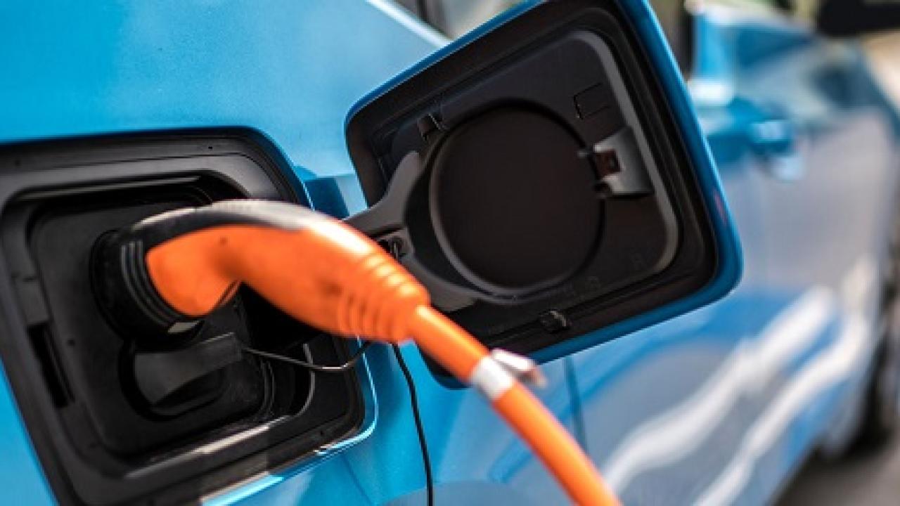 Electric vehicle being charged.