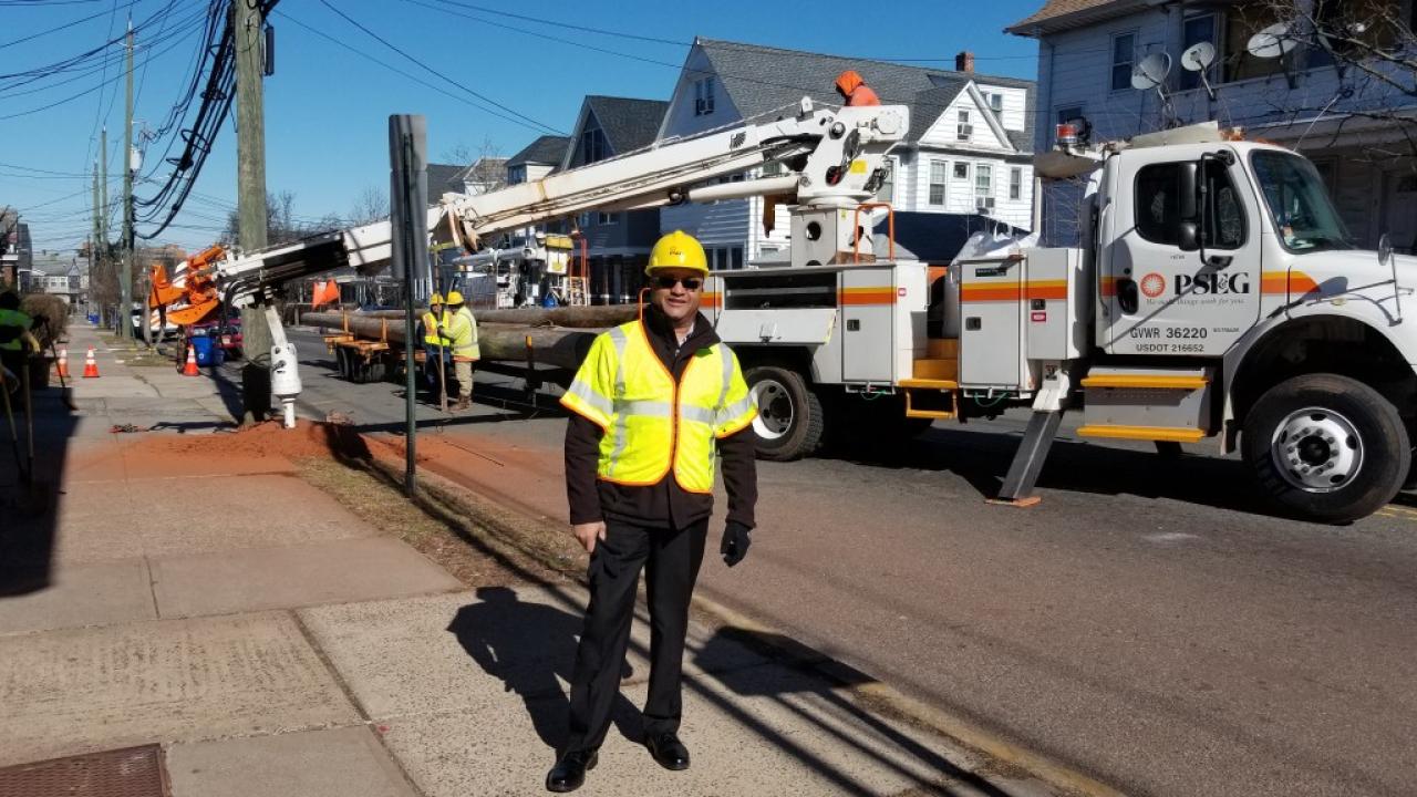 Photo of PSEG employee in protective gear in the field.