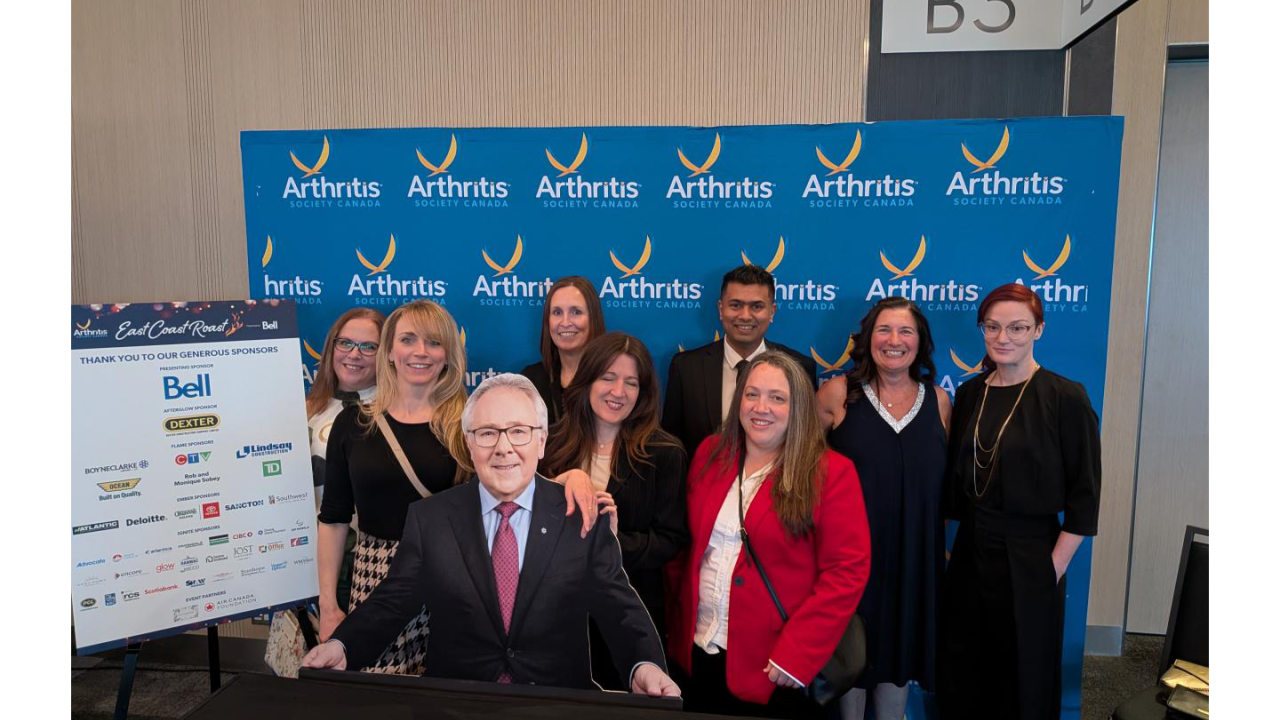DP World's Canada employees pose at step and repeat for Arthritis Society Canada event.