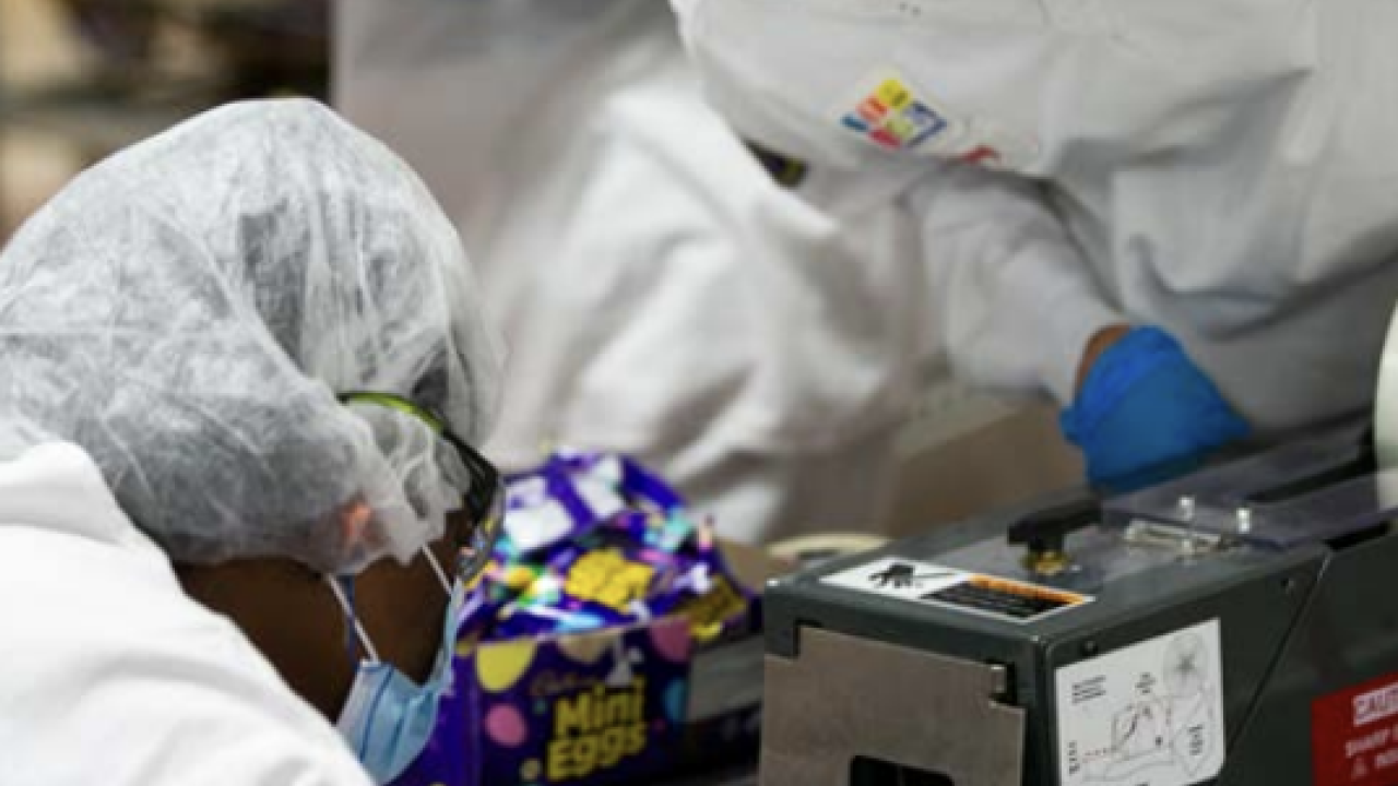 Workers packaging snacks 