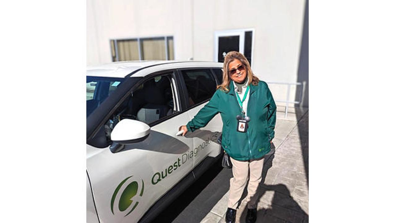 Pauline Chaves stood next to a white car