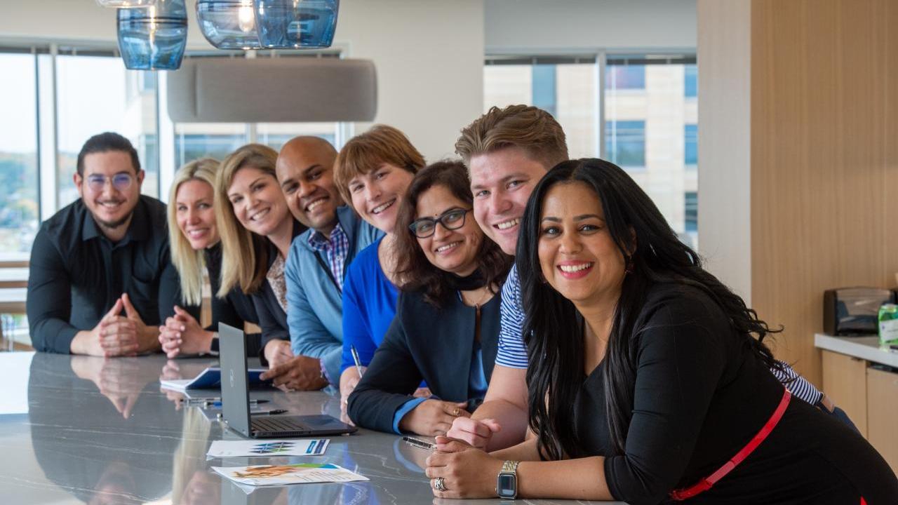 Pentair employees gather at table