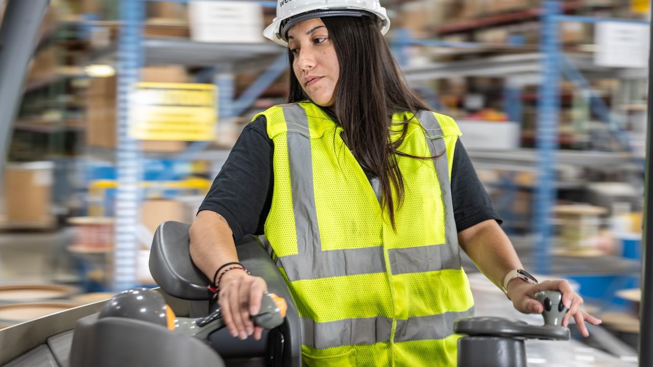 Wesco employee operating a forklift.