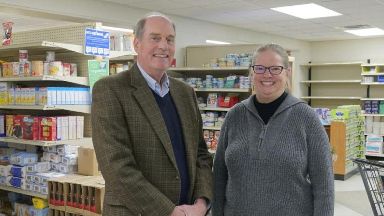 Two people stood inside a supermarket 