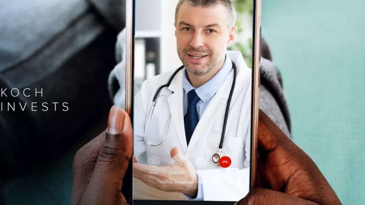 A hand holding a mobile phone  