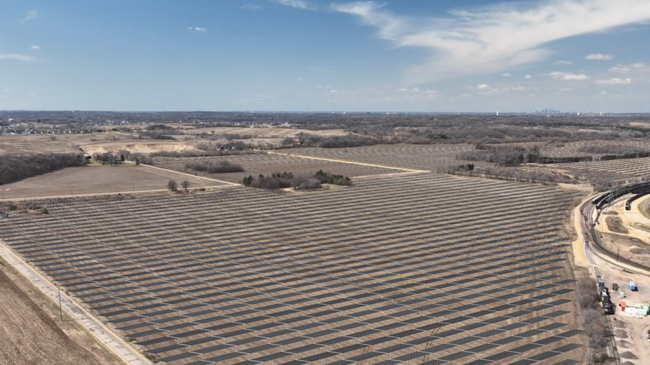 aerial view of many acres of solar panels