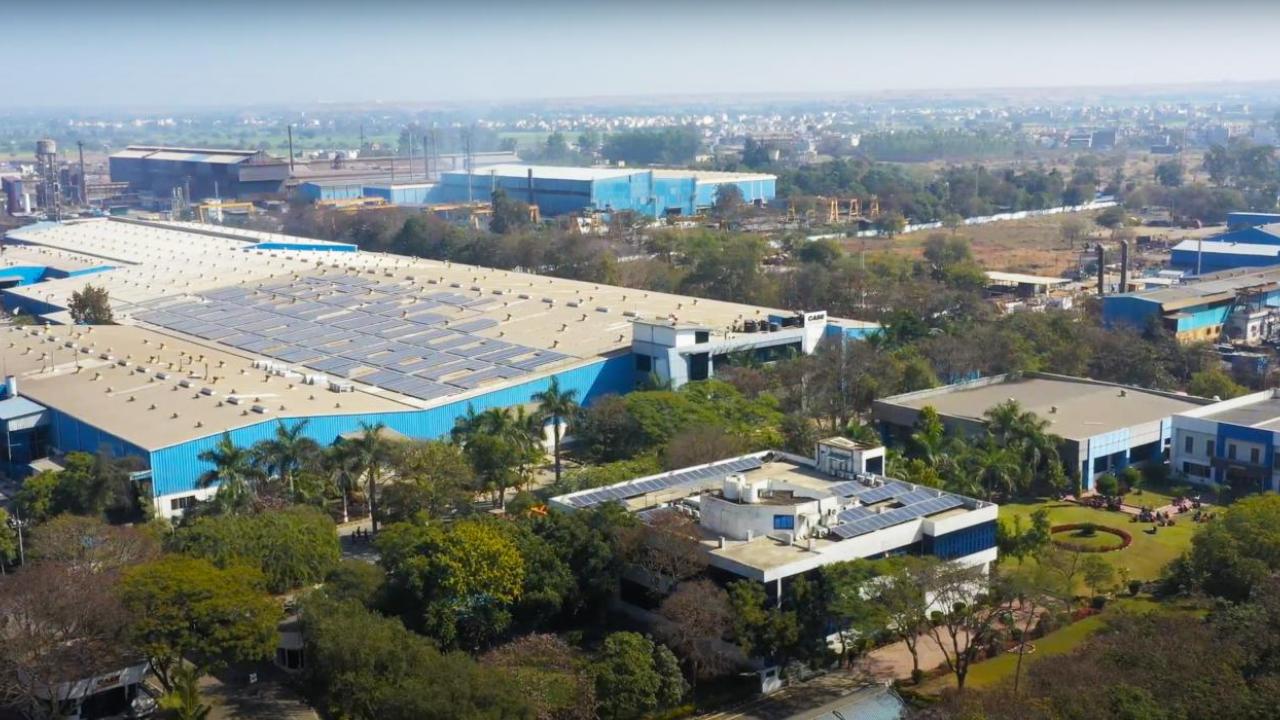 CASE Construction Equipment manufacturing plant in Pithampur, India, with solar panels on the roof