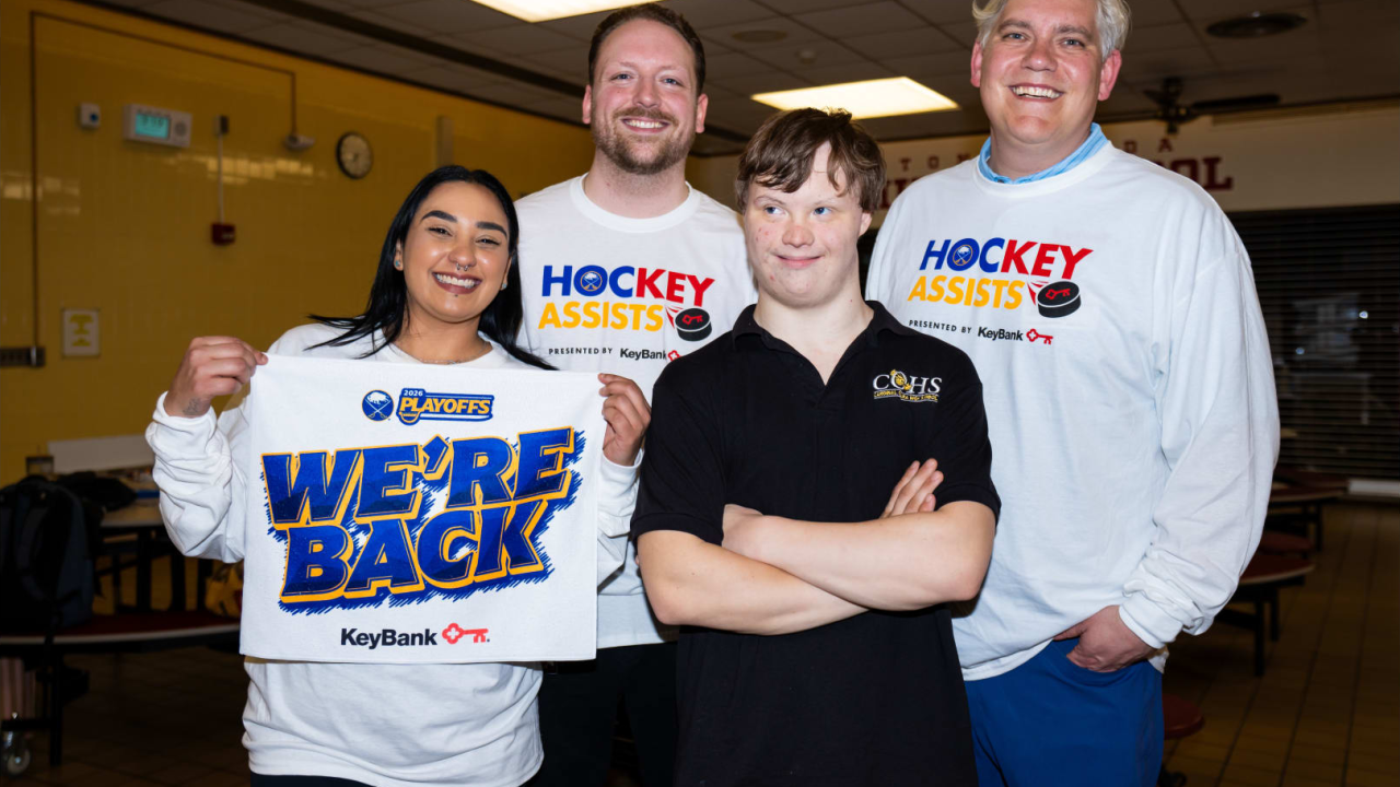 people wearing sporing shirts and smiling