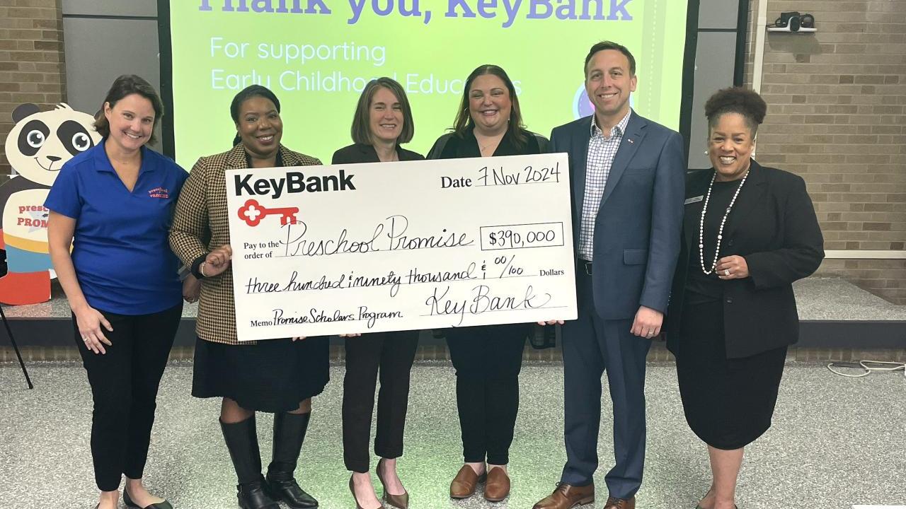 KeyBank and Preschool Promise Inc. representatives shown with a grant check for $390,000.