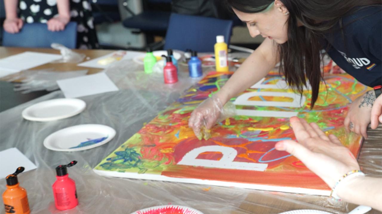 People make pride banner
