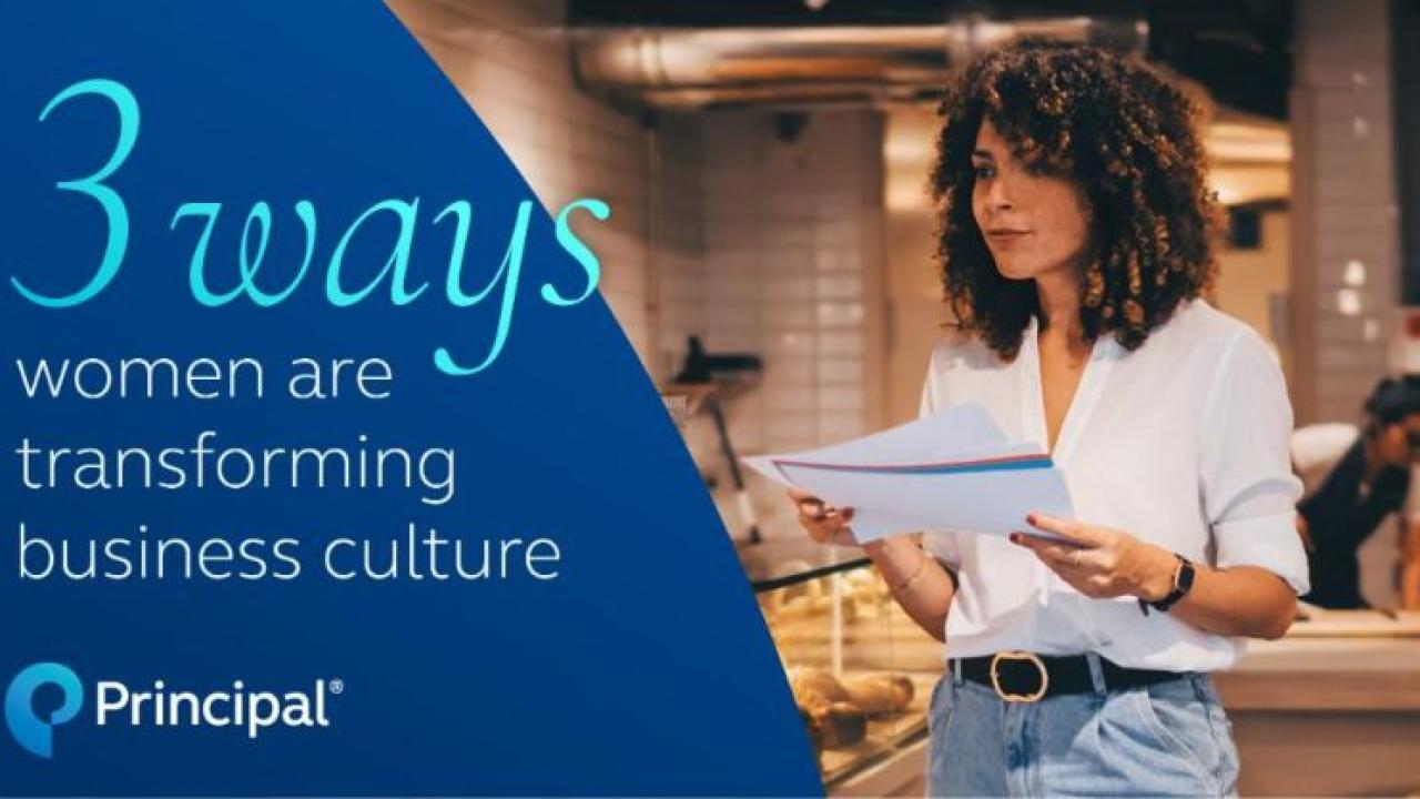 3 Ways women are transforming business culture. Woman reading a report in a restaurant.