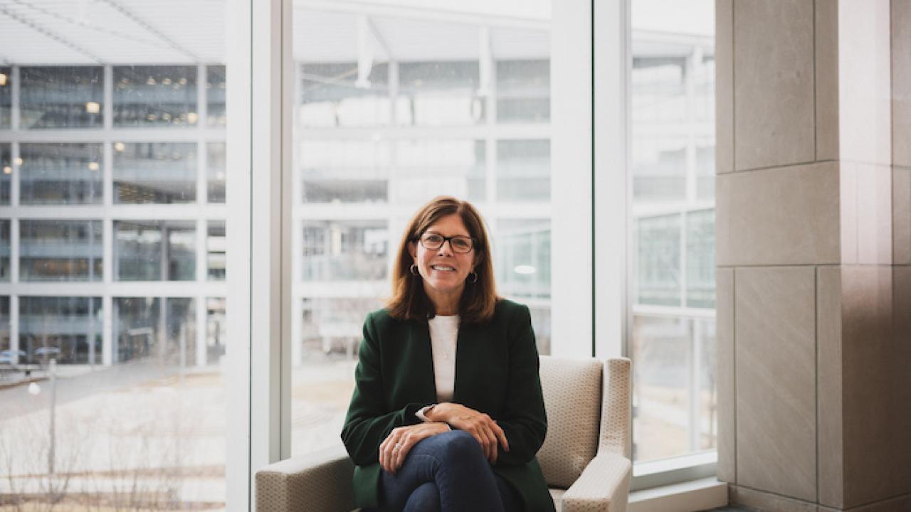 Photo of Kathy Kay seated in an office.