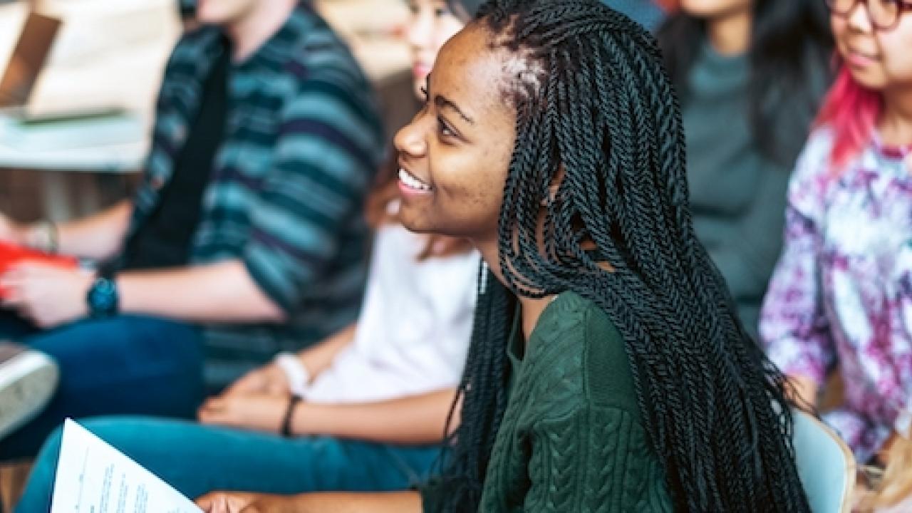 African American female shown in a classroom.