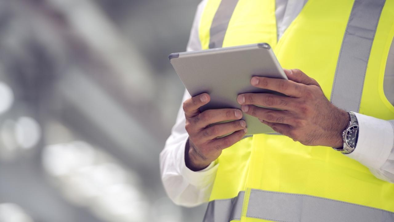 person wearing a yellow safety vest