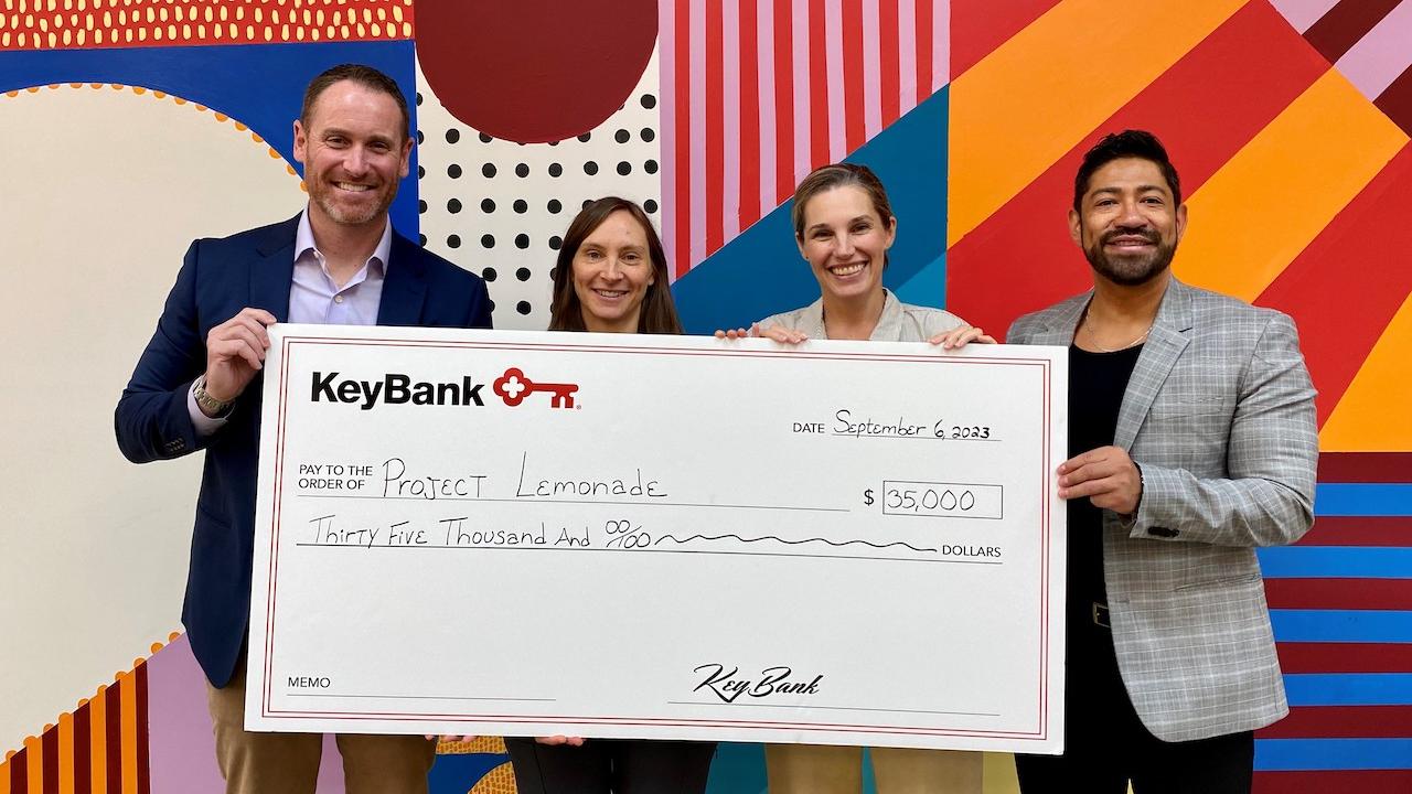 KeyBank and Project Lemonade team members shown with a grant check for $35,000.