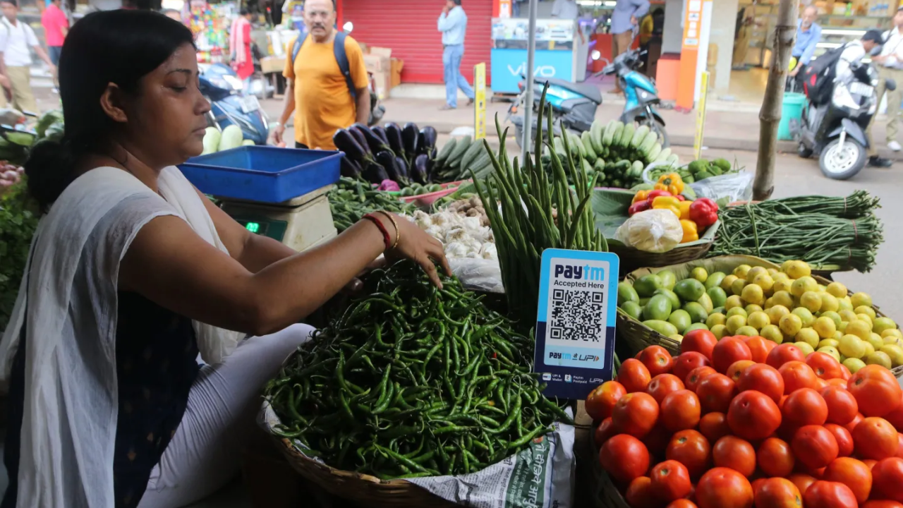 Woman working at a vegetable stand
