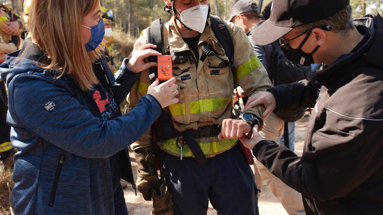 Firefighter putting on Prometeo's wearable technology 