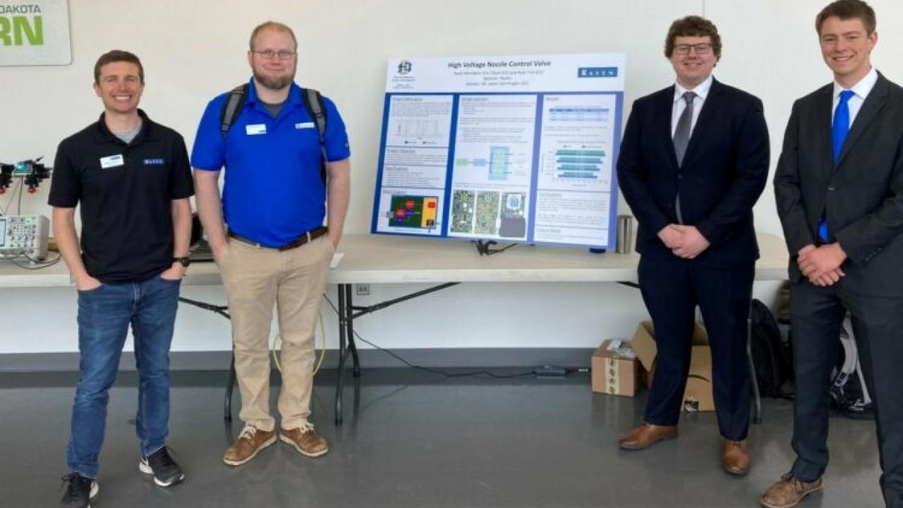 Students and faculty with a project