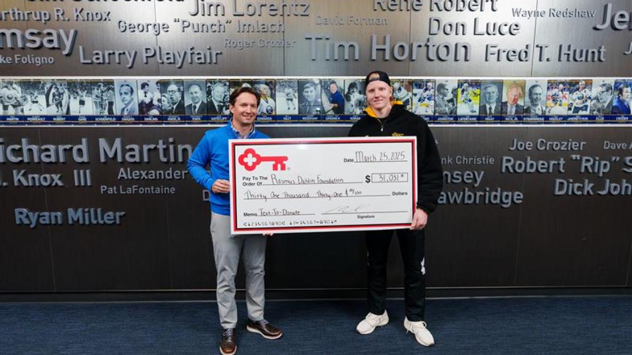KeyBank and Rasmus Dahlin Foundation members shown with a grant check for $31,031.