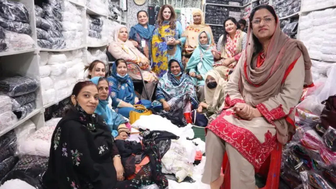 Women visit a textiles manufacturer