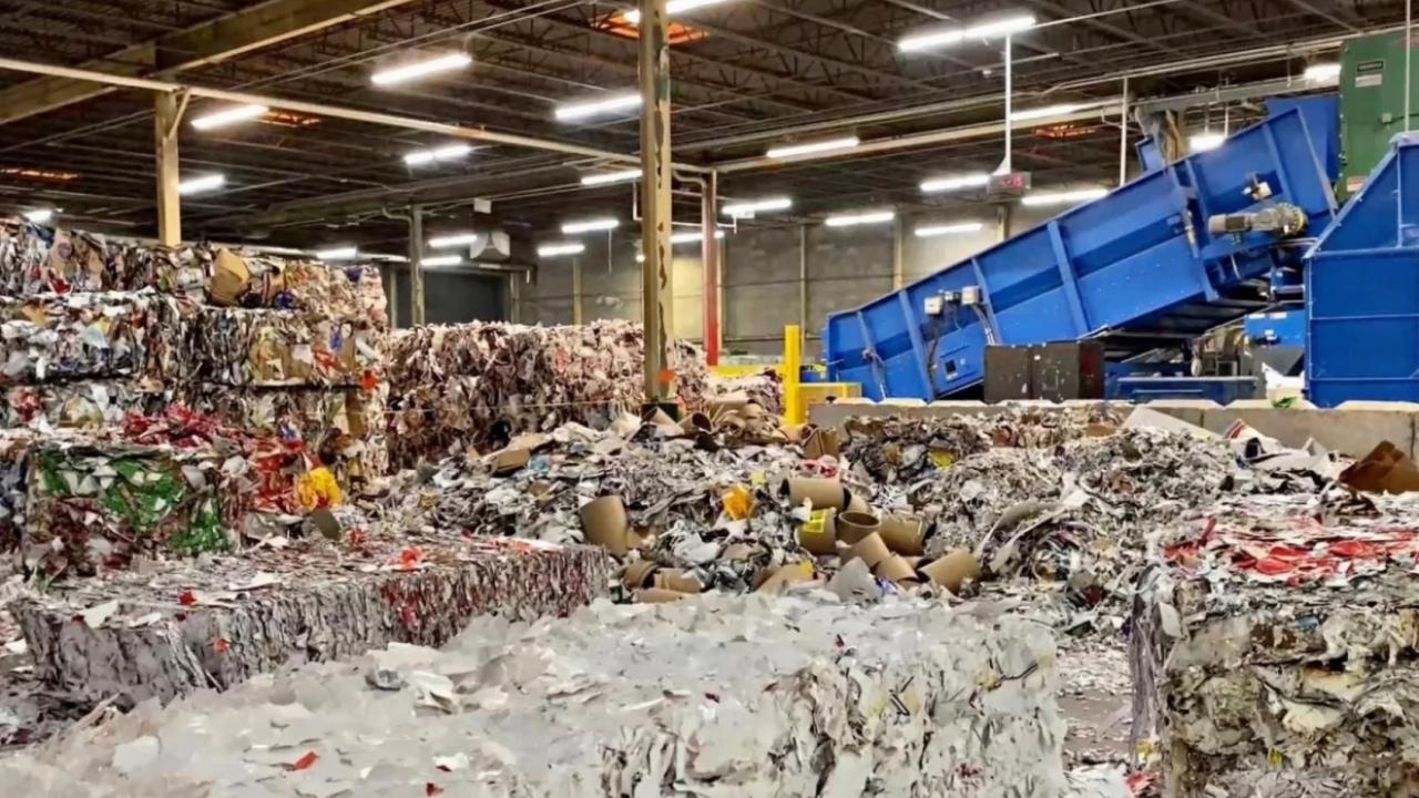 Truck dropping off a load at recycling facility