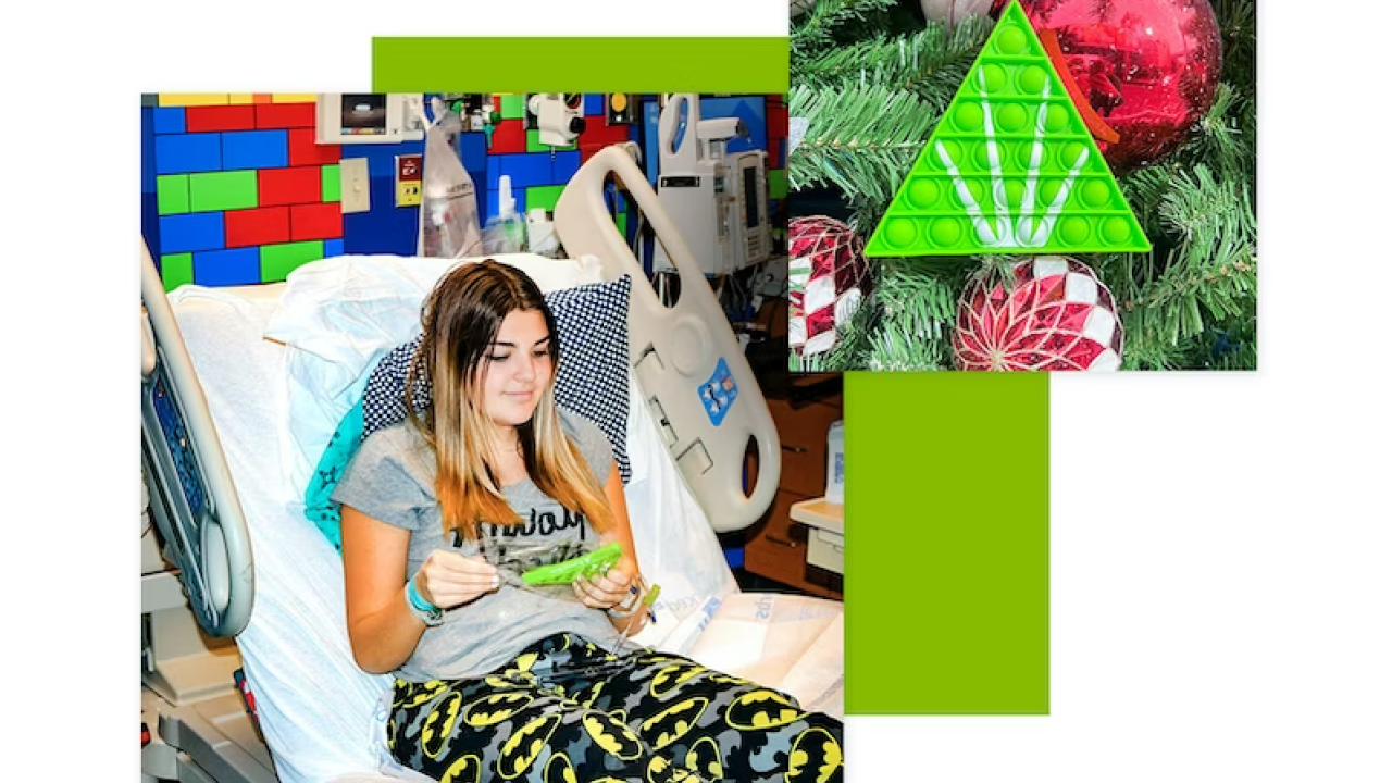 Child in hospital bed receives holiday ornament