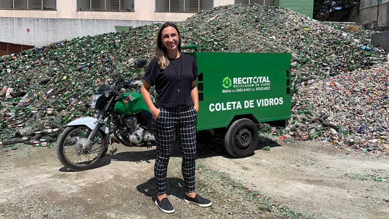 Renata Tambasco standing in front of recycled glass