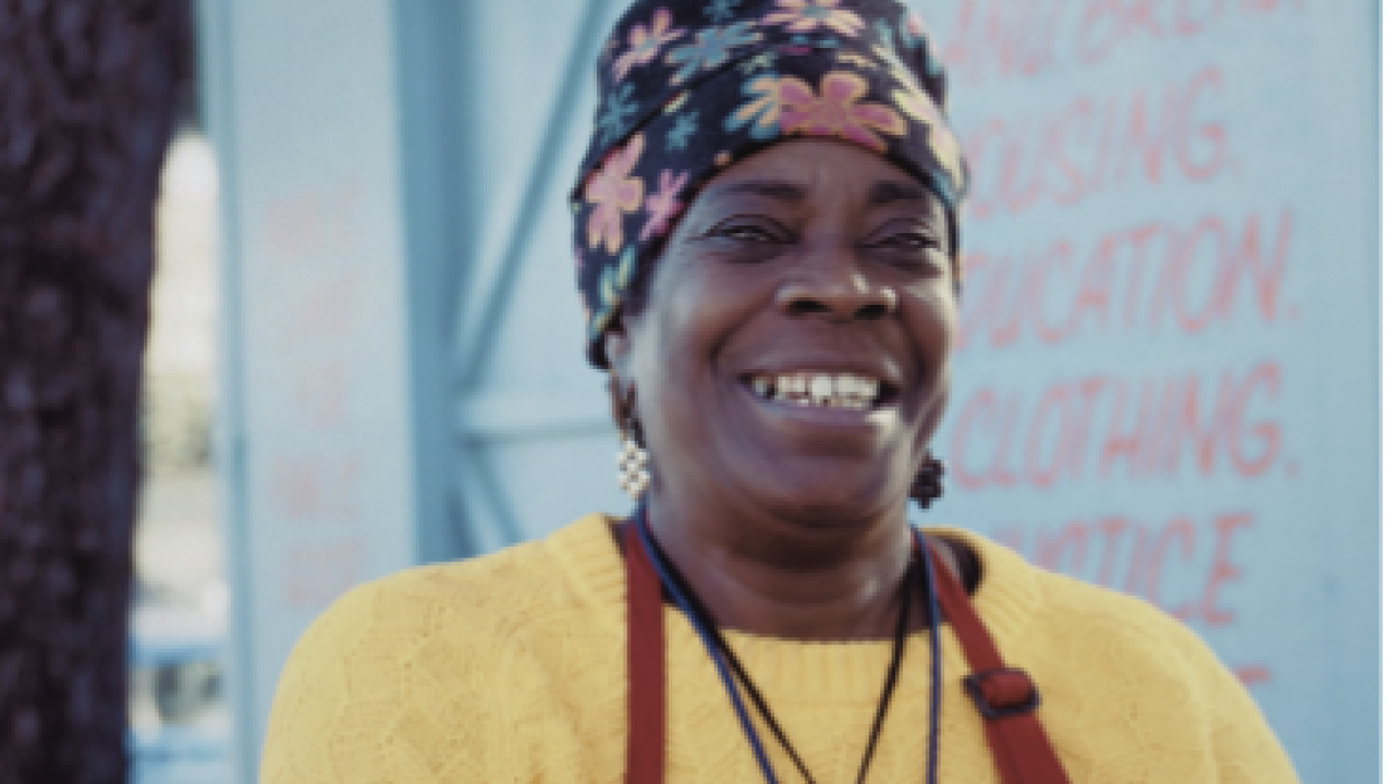 Smiling woman wearing an apron