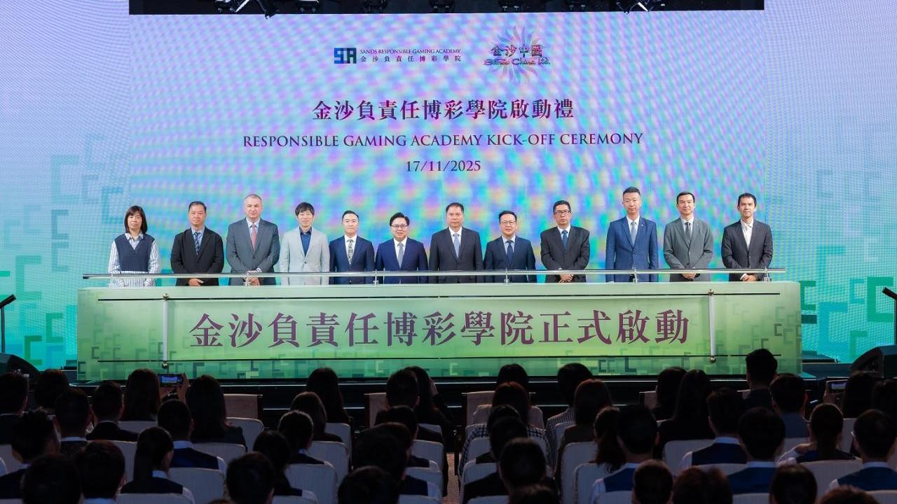 Group standing on stage under the words "Responsible Gaming Academy Kick-Off Ceremony"