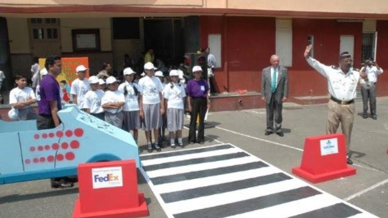 A group of people about to enter a crosswalk 