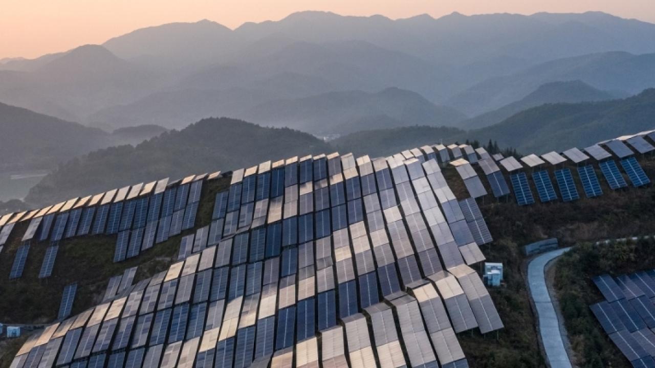 solar panels covering mountains along the skyline