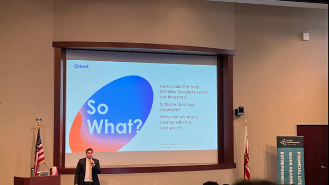 Person presenting to an auditorium