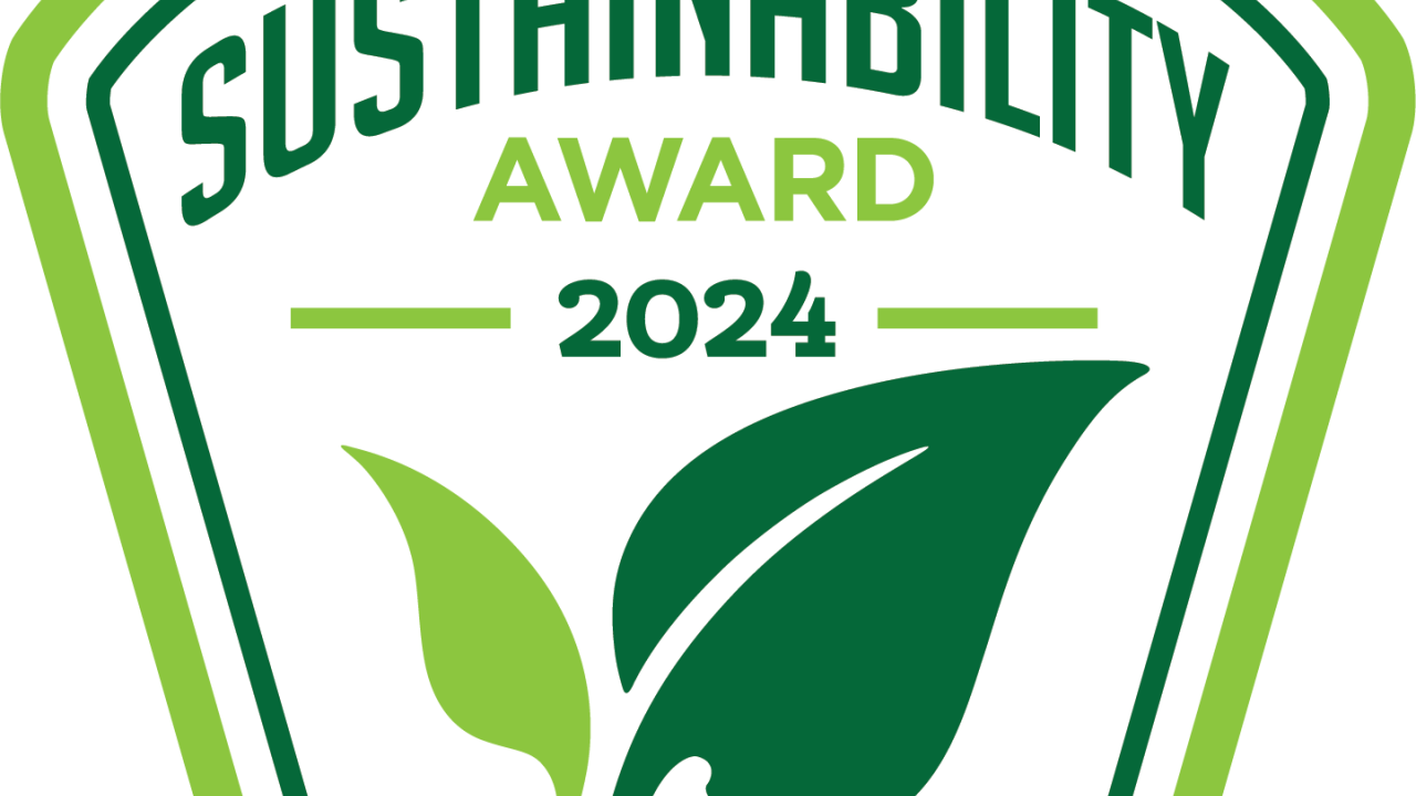Green award plaque reads, "Sustainability Award 2024"