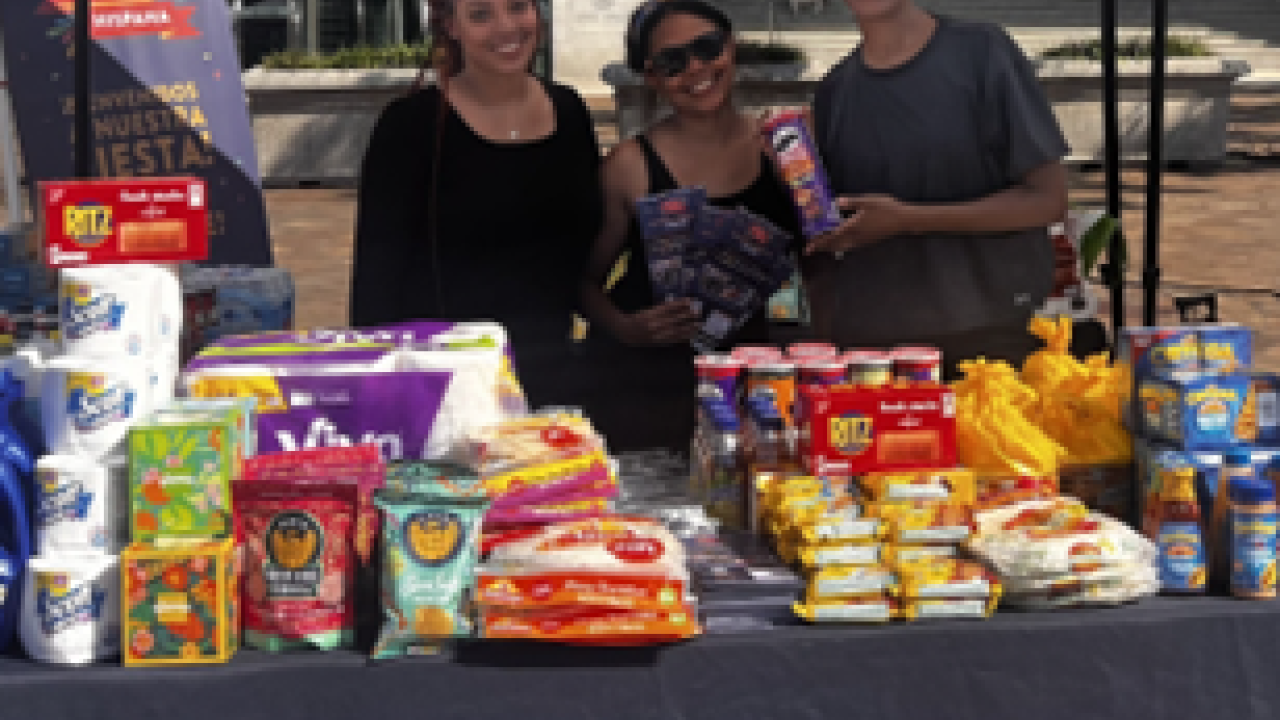 People posing at booth with "Safeway" logo