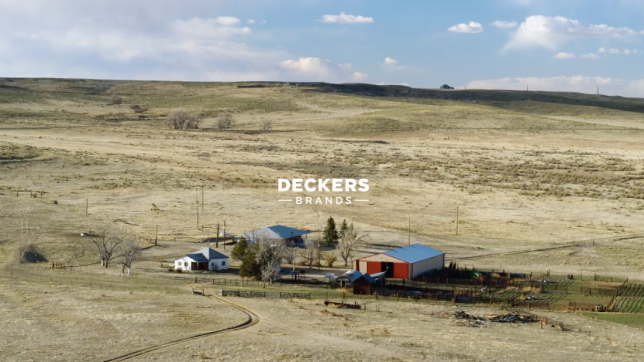 farm house in field with Deckers logo