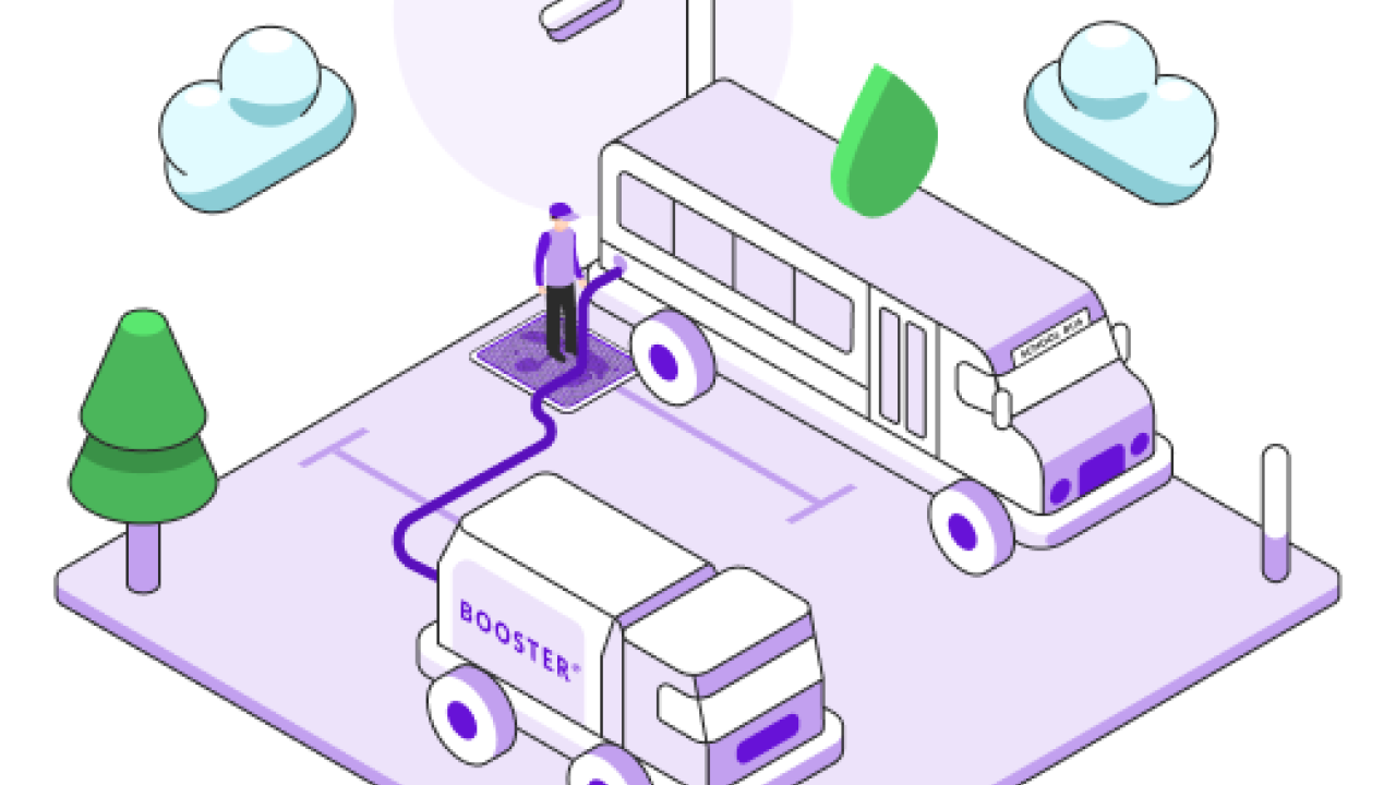 A Booster service professional fuels a school bus. 