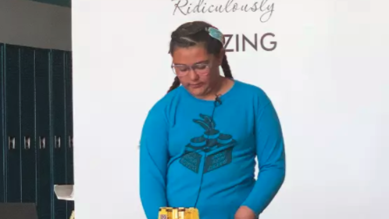 Abigail Cota, a member of the Shoshone, Paiute, and Tlingit tribes and student at the Duck Valley Indian Reservation's Owyhee Combined School, demonstrates Lego robots for the Native Voices in Idaho project.