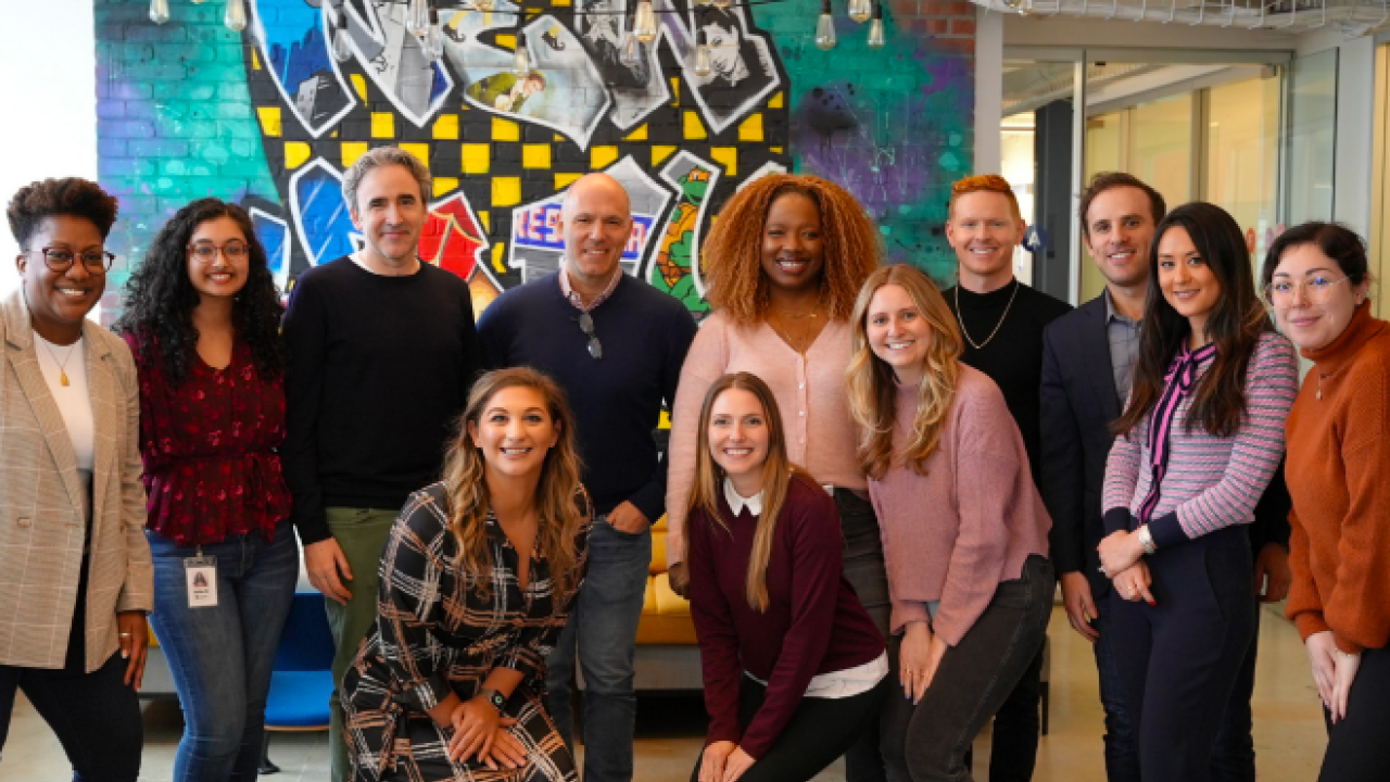 Expedia Group employees standing with Michael Davis Velasco and Peter Kern following an Inclusion & Diversity Town Hall.