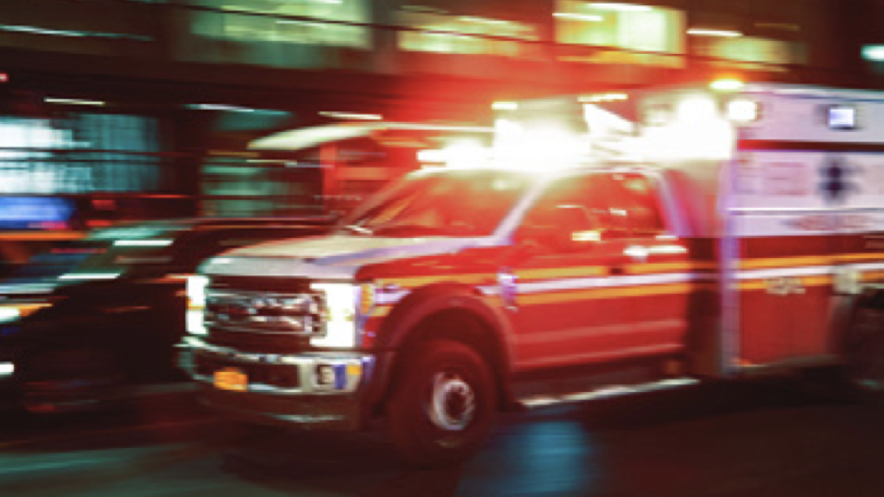 ambulance on a city street at night