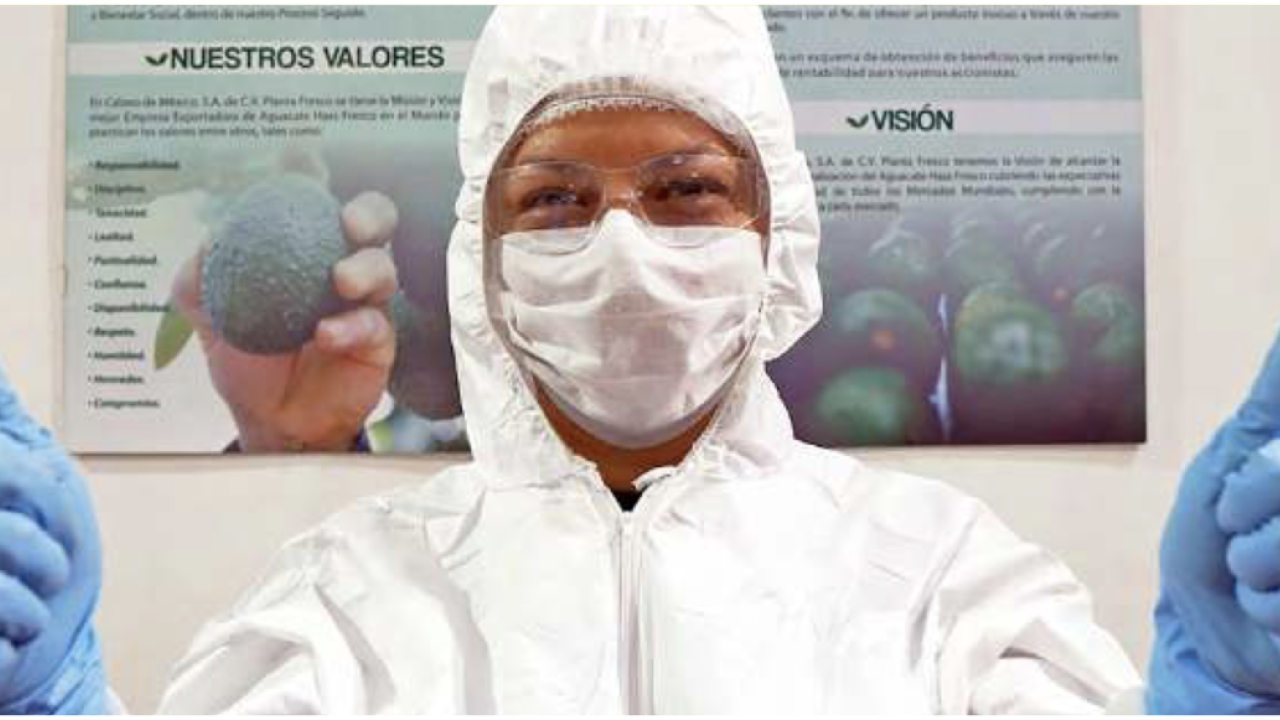 employee in full ppe giving two thumbs up