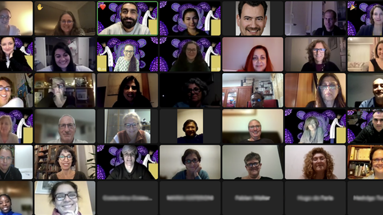 A group of people, some showing video while some are off camera, chat online on expanded partnership.