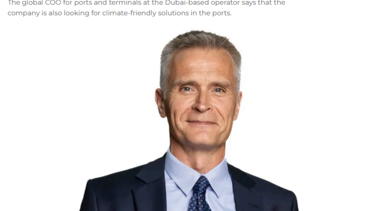 Portrait of Tiemen Meester, DP World's Global COO for Ports & Terminals, wearing a navy suit and blue tie, as featured in a ShippingWatch article about the company’s investments in climate protection and port resilience.