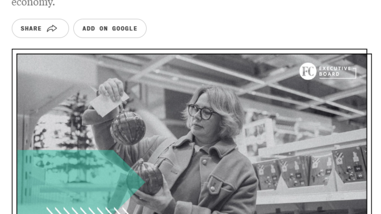A shopper examines holiday ornaments on a store shelf, illustrating how record retail demand places pressure on supply chains during peak season.