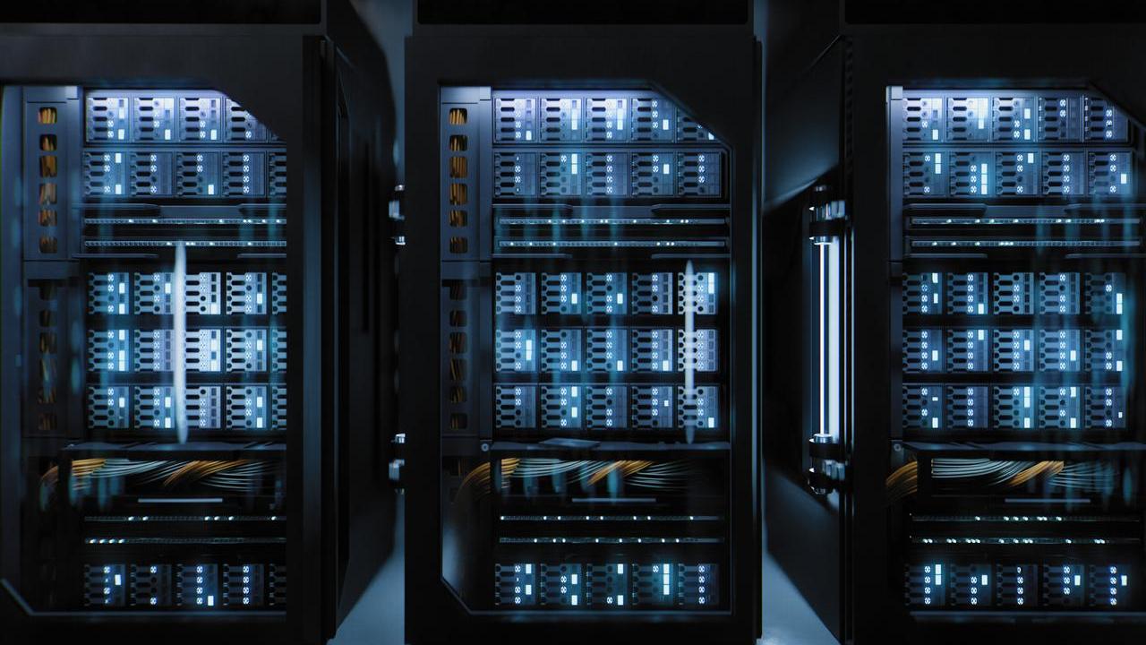 Server racks inside a modern data center, housing high-density computing equipment used for cloud computing and AI workloads.
