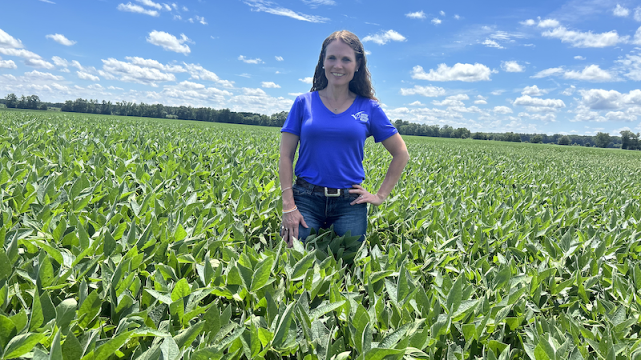 Woman standing in soybean field