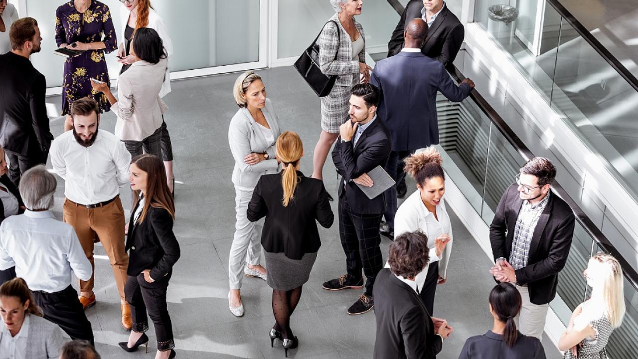 Group of people standing in conversation